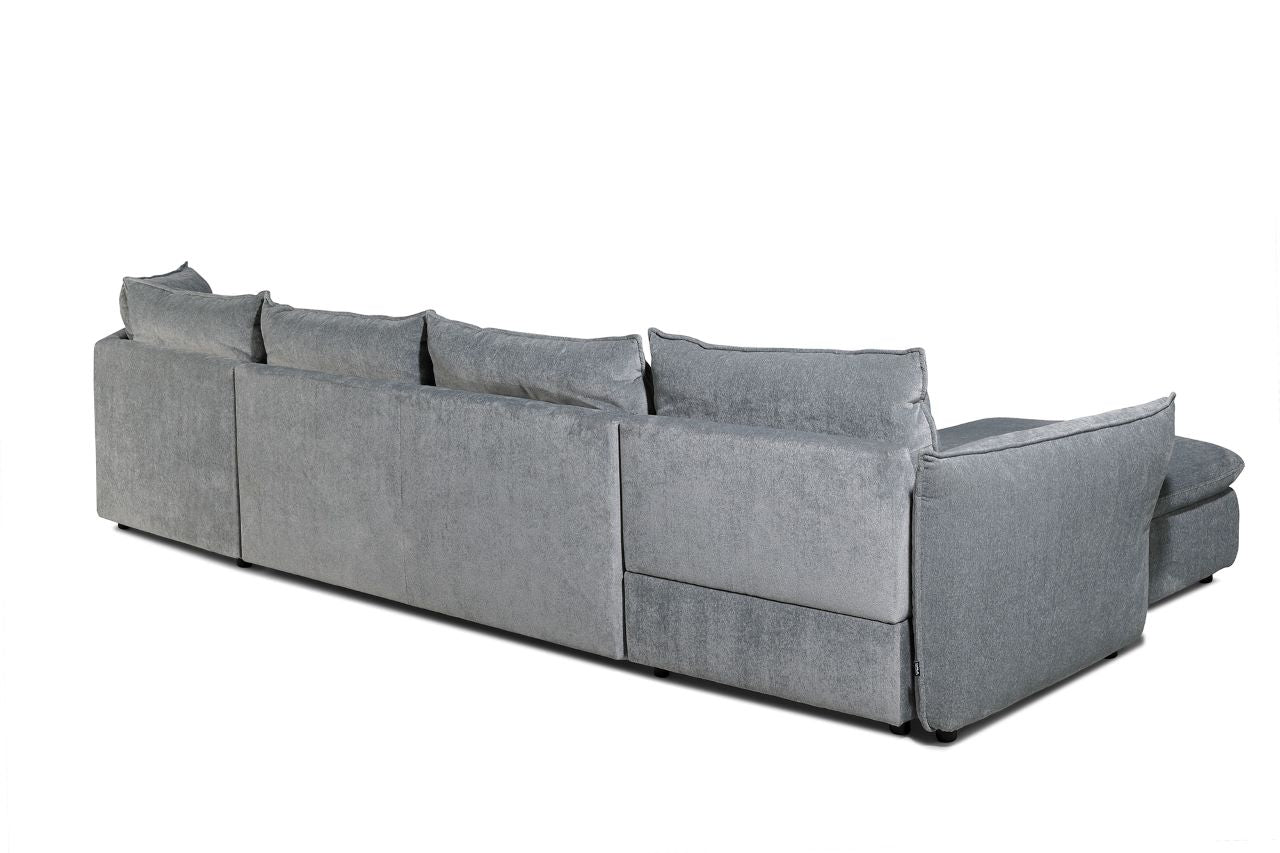 Térben elhelyezhető nagy szürke sarokkanapé.