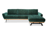 Sötétzöld bársony sarokkanapé magas lábakkal