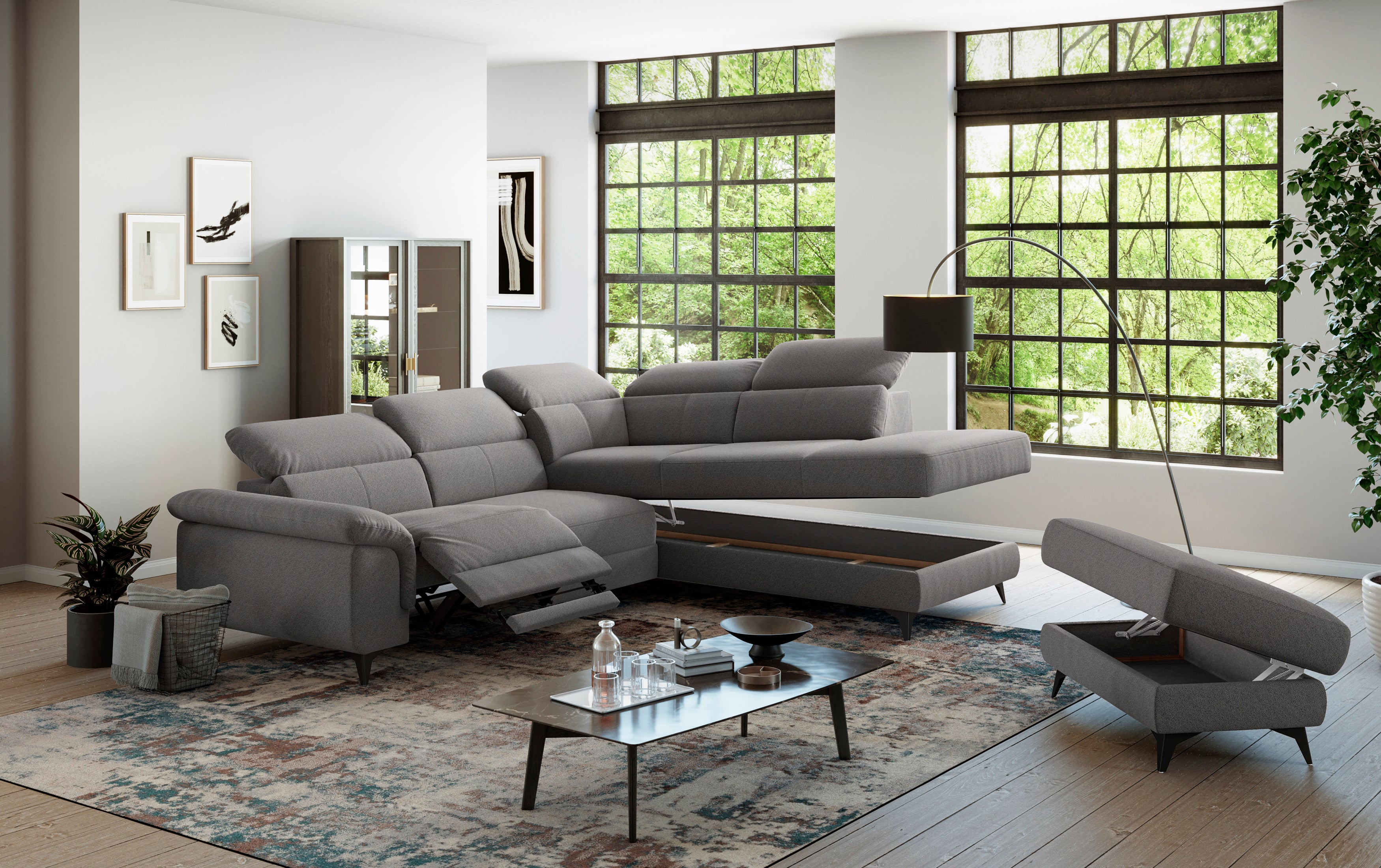 Szürke sarokkanapé állítható fejtámlával és relax funkcióval.