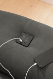 Szürke L alakú kanapé RGB világítással, hangszóróval, USB csatlakozóval.
