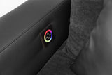 Fekete kanapé RGB világítással, hangszóróval és bluetooth kapcsolattal.